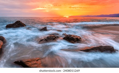 A Beautiful Ocean Sunset With A Wave Breaking On Shore High Resolution - Powered by Shutterstock