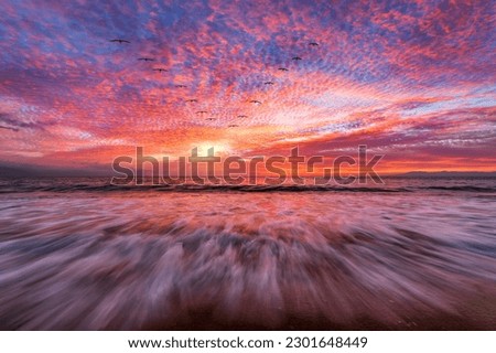 A Beautiful Ocean Sunset With A Wave Breaking On Shore High Resolution