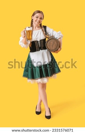 Beautiful Octoberfest waitress with beer and barrel on yellow background Foto stock © 