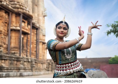 Beautiful Odissi dancer Closeup view against temple background. Orissi is a major ancient Indian classical dance form.Iindian tribal dance