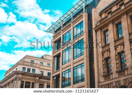 beautiful office buildings with cloud reflections in the panoramic blue windows