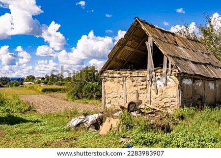 Beautiful old abandoned building farm house in countryside on natural background, photography consisting of old abandoned building farm house at wild grass, old abandoned building farm house over sky