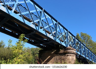 Beautiful old French railway bridge above a dry river. Beautiful old French railway bridge above a dry river. Photo was taken on a sunny day with an awesome blue sky.