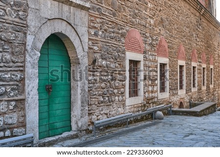 Beautiful old green door, windows and wall of Tophane-i Amire (Imperial armory) of Ottomans, Istanbul, Turkey