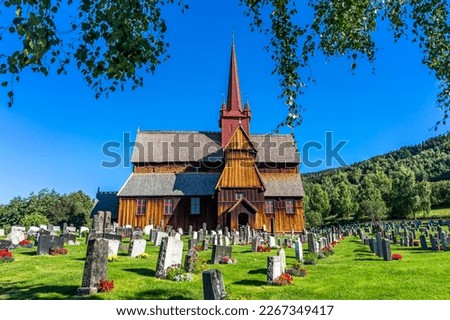 Beautiful old historic Ringebu stave church in Norway with cemetery