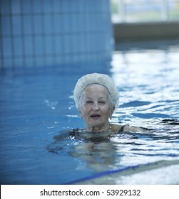 Beautiful Old Senior  Woman Have Fun And Recreation On Swimming Pool