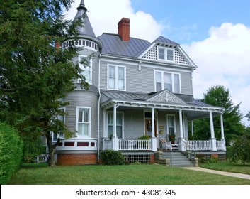 A beautiful old Victorian mansion on a big lot and a nice porch.