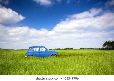 Beautiful old vintage car on a green meadow