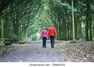 Beautiful Older Loving Couple Going For A Walk In A Forest