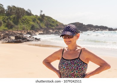 Beautiful Older Woman In Hat, Sunglasses And Bathing Suit At Beach (selective Focus)