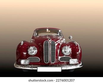 A beautiful oldtimer german vintage car in a bordeaux-red color