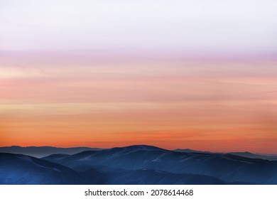 Beautiful orange sky over mountain range at sunset - Powered by Shutterstock