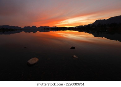 A beautiful orange sunset over a dam in Worcester, Breede River Valley,South Africa. - Powered by Shutterstock