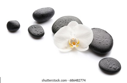 Beautiful orchid flower with stones on white background - Powered by Shutterstock