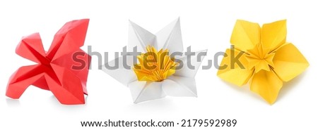 Beautiful origami flowers on white background