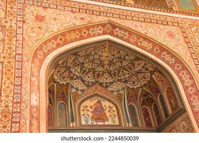 Beautiful ornate carvings on the exterior arch and entrance walls of the Historic Amber palace in the city of Jaipur in Rajasthan, India.