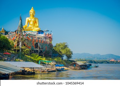 Beautiful outdoor view of golden budha located at golden triangle Laos