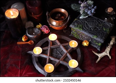 Beautiful Pagan Altar With Pentagram Candle Holder And Magical Items