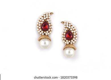 Beautiful Pair Of Earrings Pearl With Red Gemstone On A White Background. Luxury Female Jewelry, Indian Traditional Jewellery, ,Bridal Gold Earrings Wedding Jewellery