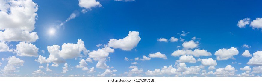 Beautiful Panorama Blue Sky And Clouds With Sun And Daylight Natural Background. Panoramic Composition In High Resolution.