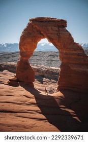 beautiful panorama of the delicate arch in the arches national park in moab, united states of america on a sunny day with blue sky and clouds