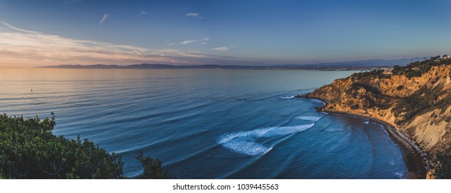 Beautiful panorama of the giant bluffs and homes of Flat Rock Point at sunset with coastline view of nearby South Bay beach cities in the background, Palos Verdes Estates, California - Powered by Shutterstock