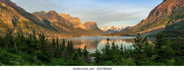 A beautiful panorama of the morning light over St. Mary Lake in Glacier National Park. - Powered by Shutterstock