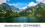 Beautiful panorama of a mountain lake. Mountain lake panorama. Beautiful mountain lake panoramic landscape. Mountain lake panoramic landscape