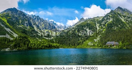 Beautiful panorama of a mountain lake. Mountain lake panorama. Beautiful mountain lake panoramic landscape. Mountain lake panoramic landscape