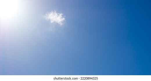 Beautiful Panorama Sky With One Cloud And Sunlight.