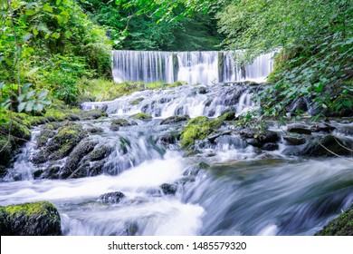 Beautiful panorama view of water fall landscape at green forest in the summer, Ghyll Force, Ambleside, Lake District National Park, UK - Powered by Shutterstock