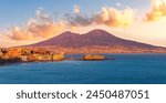 beautiful panorama of volcano Vesuveus from Naples with blue water of sea gulf, majectic mountain and amazing cloudy sunset sky on background