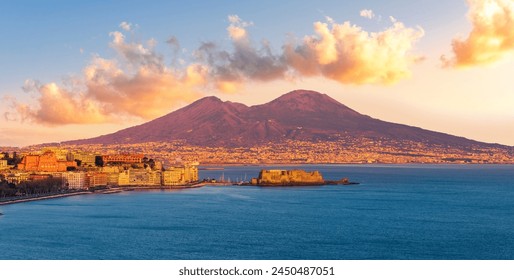 beautiful panorama of volcano Vesuveus from Naples with blue water of sea gulf, majectic mountain and amazing cloudy sunset sky on background - Powered by Shutterstock