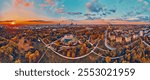 A beautiful panoramic aerial drone view of the sunset at Pola Mokotowskie in Warsaw, Poland - "Mokotow Field" is a large park in Warsaw - Is called "Jozef Pilsudski Park" or "Warsaw Central Park", EU