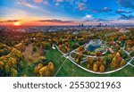 A beautiful panoramic aerial drone view of the sunset at Pola Mokotowskie in Warsaw, Poland - "Mokotow Field" is a large park in Warsaw - Is called "Jozef Pilsudski Park" or "Warsaw Central Park", EU