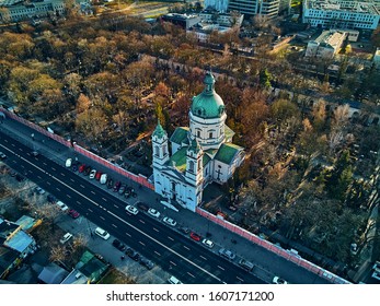 Beautiful panoramic aerial drone view to the ?enter modern Warsaw city and silhouettes skyscrapers   Church Karol Boromeusz (at the Powazki Cemetery) in amazing winter January sunset  Poland