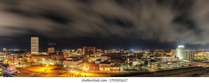 Beautiful Panoramic Aerial View Of Down Town In Galveston, Texas. Long Exposure. Night Cloudy Sky In The Background.