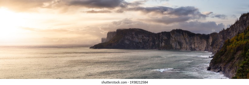 Beautiful Panoramic Canadian Landscape Of A Rocky Coastline On The East Coast. Dramatic Sunrise Sky Art Render. Taken In Forillon National Park, Near Gaspe, Quebec, Canada.