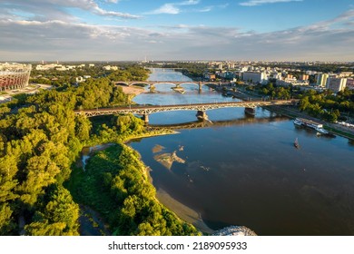 Beautiful Panoramic Drone View Of The Centre Of Modern Warsaw With Silhouettes Of Skyscrapers In The Sunset. View From The Area Of Świętokrzyski Bridge