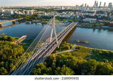 Beautiful Panoramic Drone View Of The Centre Of Modern Warsaw With Silhouettes Of Skyscrapers In The Sunset. View From The Area Of Świętokrzyski Bridge