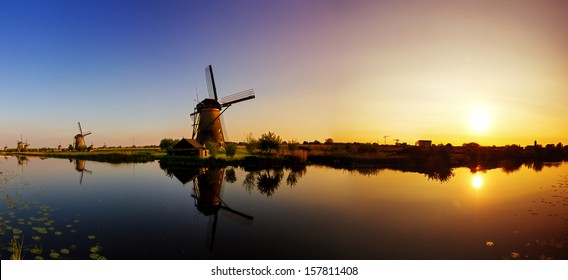 Beautiful panoramic image of the dutch windmills at Kinderdijk, the Netherlands. An UNESCO world heritage site. HDR - Powered by Shutterstock