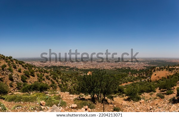 Beautiful panoramic\
photo of the moroccan city of Beni Mellal seen from the height of\
the middle atlas and the tadla plain. Concept panoramic,\
photography, morocco, beni\
melal.