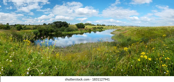 Beautiful panoramic rural landscape with calm river and green hills with blooming wild flowers and trees at sunny summer day.River Upa in Tula region,Russia. - Powered by Shutterstock