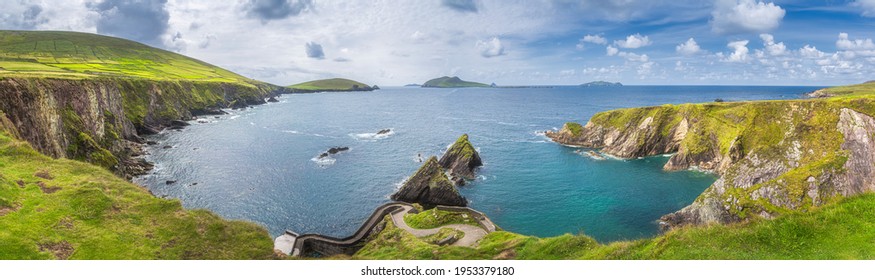 Beautiful panoramic shot of amazing Dunquin Pier and harbour with tall cliffs, turquoise water and islands, Dingle, Wild Atlantic Way, Kerry, Ireland - Shutterstock ID 1953379180