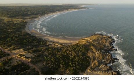 Beautiful Panoramic Shot Of Playa Grande Beach At Sunset In Uruguay. Blue Water And Yellow Sandy Beaches