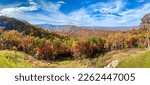 A beautiful panoramic view of the Blue Ridge Parkway in Boone, NC during the autumn fall color changing season at sunset.