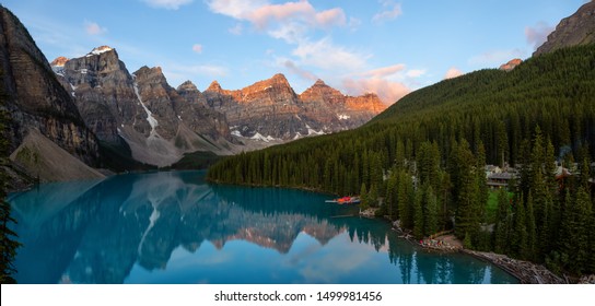 Beautiful Panoramic view of an Iconic Famous Place, Moraine Lake, during a vibrant summer sunrise. Located in Banff National Park, Alberta, Canada. - Powered by Shutterstock