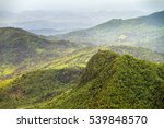 Beautiful panoramic view over the hills in the jungle of the El Yunque national forest in Puerto Rico, with the Torre Britton