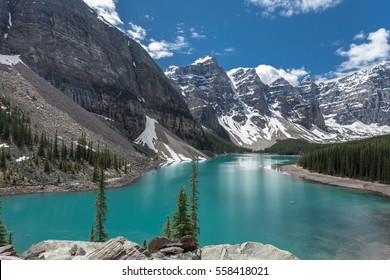 Beautiful Panoramic View Over Moraine Lake In Jasper National Park, Summer Canadian Rockies, Canada. Sunny Day With Amazing Blue Sky. Majestic Mountains In The Background. Clear Turquoise Blue Water. 