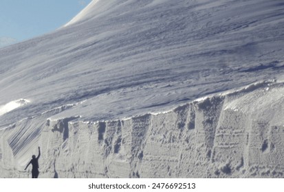 Beautiful panoramic view of a person on snow covered mountain in winter in Belagoa valley, Navarra, Spain - Powered by Shutterstock